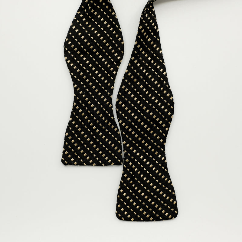 Black bow tie with gold square polka dots 
